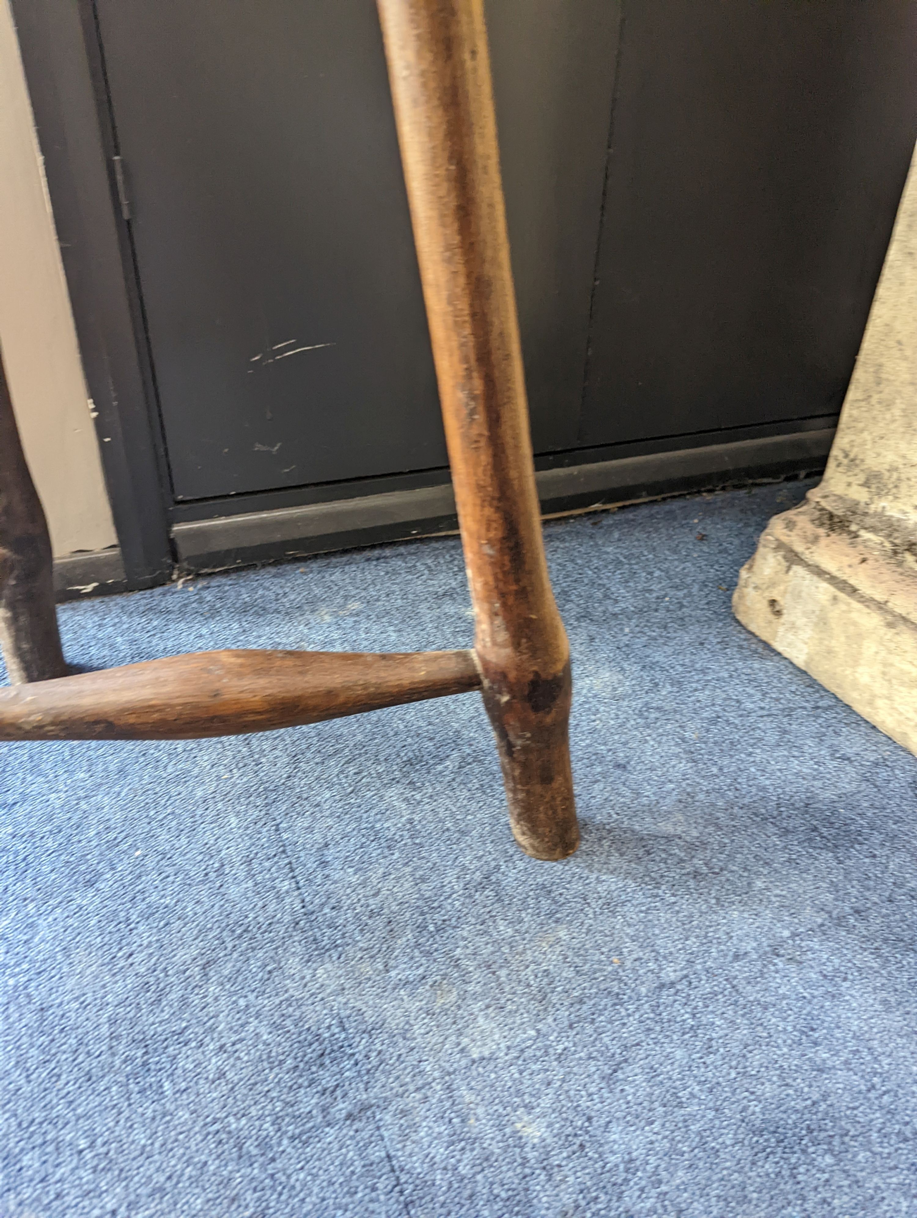 A circular burr elm and ash primitive cricket table with T shaped stretcher, diameter 44cm, height 61cm